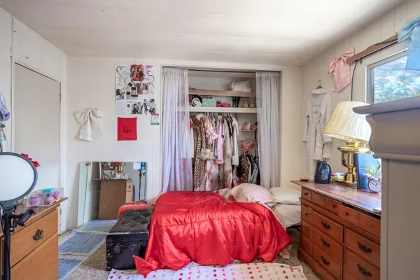 a bathroom with a granite countertop shower a toilet and a shower