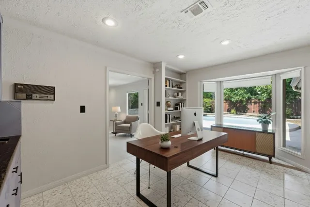 a view of a workspace with furniture