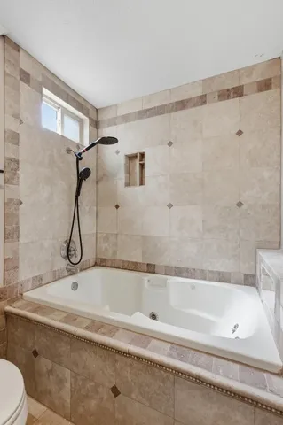 a bathroom with a bath tub and a shower