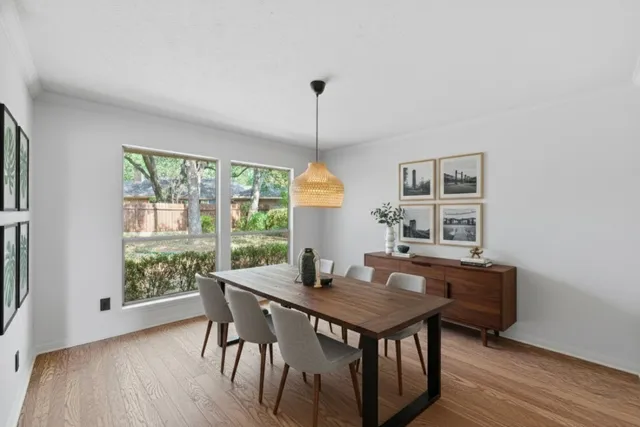 a dining room with furniture window wooden floor