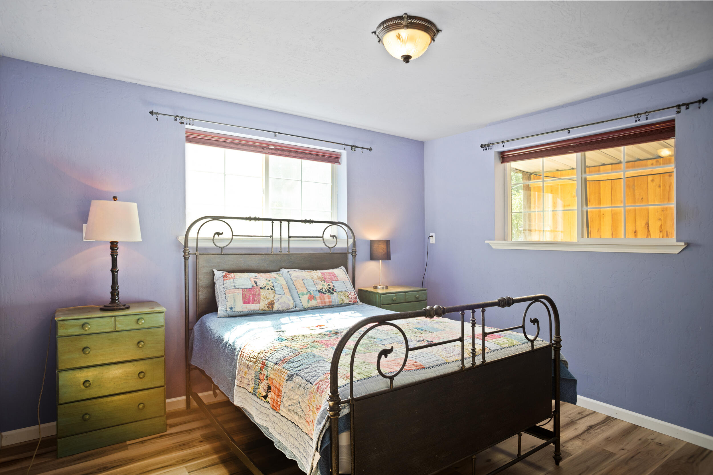 255 Queens Branch Road Rogue River, OR 97537 - Photo 26 of 60 a bedroom with a bed and a window