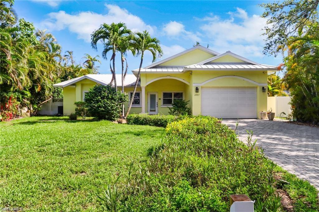 2447 Harbor Road Naples, FL 34104 - Photo 5 of 10 a front view of a house with a garden