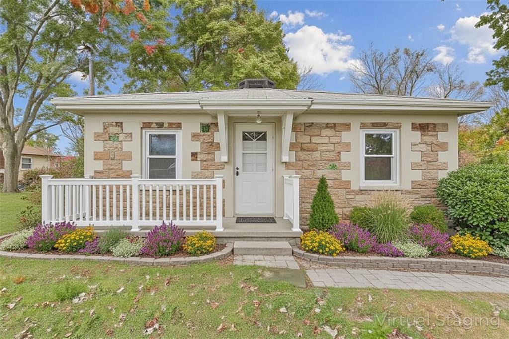 front view of a house with a garden