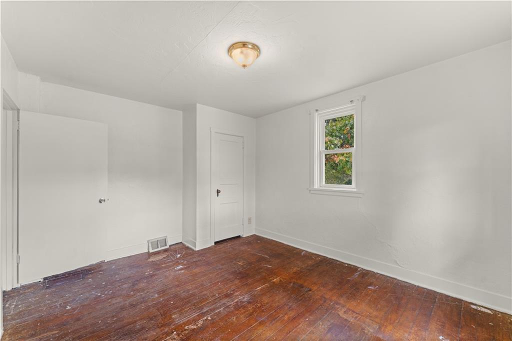 120 Grohman Road Butler, PA 16002 - Photo 15 of 28 a view of a room with a wooden floor and a window