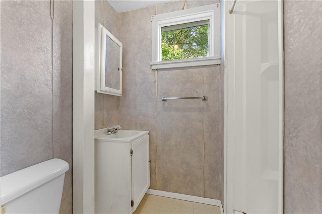 120 Grohman Road Butler, PA 16002 - Photo 19 of 28 a bathroom with a sink toilet and window