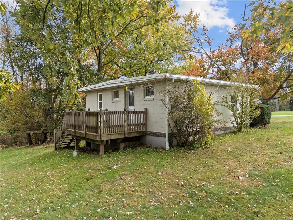 120 Grohman Road Butler, PA 16002 - Photo 23 of 28 a backyard of a house with wooden fence and large trees