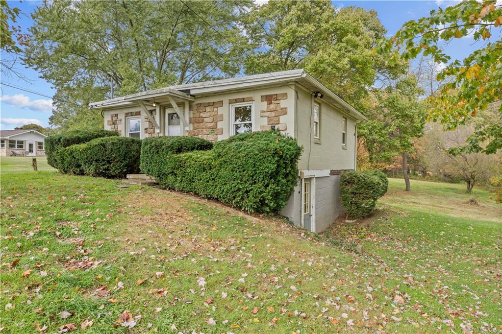 120 Grohman Road Butler, PA 16002 - Photo 28 of 28 a view of a house with backyard and a tree