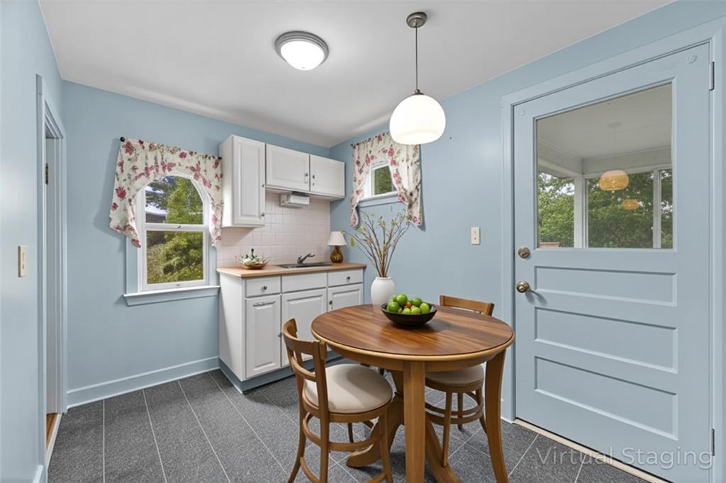 120 Grohman Road Butler, PA 16002 - Photo 9 of 28 a kitchen with a table and chairs in it