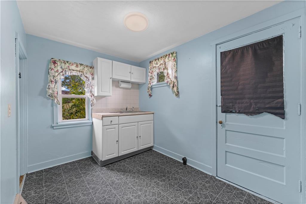 120 Grohman Road Butler, PA 16002 - Photo 10 of 28 a room with a white cabinets and a window