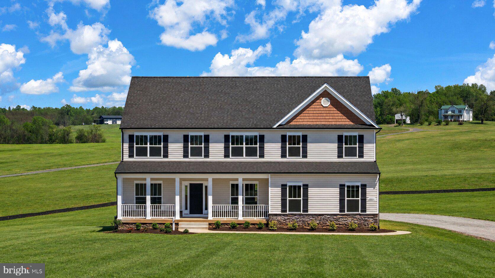 18237 Stevensburg Road Stevensburg, VA 22741 - Photo 1 of 40 a front view of a house with a garden