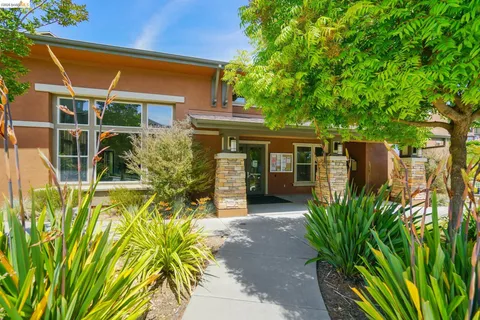 a front view of a building with garden
