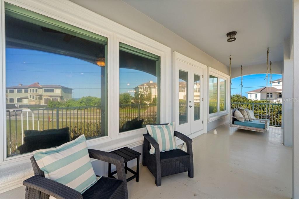 2 Mar Azul North Ponce Inlet, FL 32127 - Photo 23 of 98 a living room with furniture floor to ceiling window and wooden floor