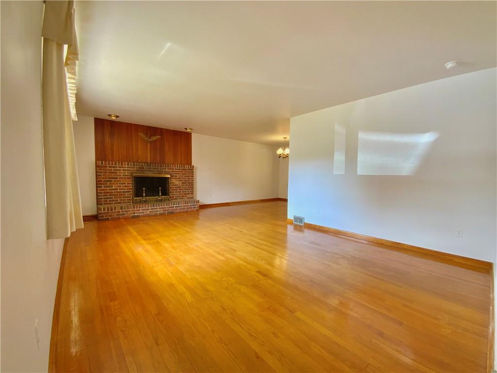 204 Hall Road Aliquippa, PA 15001 - Photo 4 of 30 Living room with a wood burning fireplace