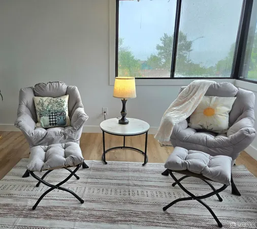 a bed room with a bed and a chair
