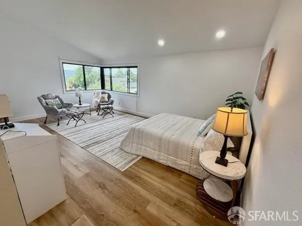 a view of a yard with wooden fence