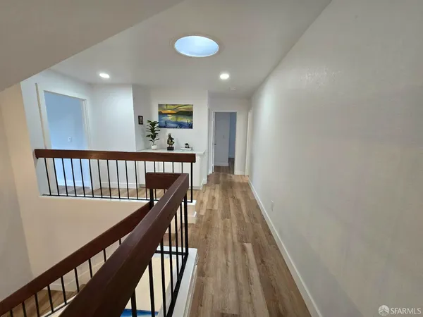 a kitchen with stainless steel appliances a refrigerator sink and microwave