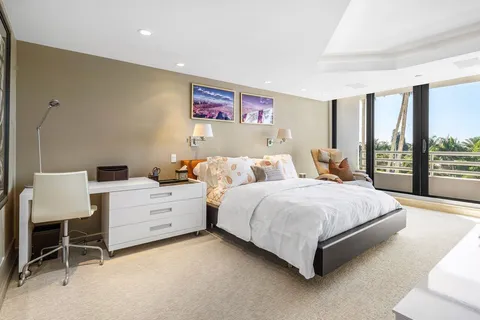 a spacious bedroom with a bed and window