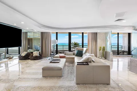 a living room with fireplace furniture and a flat screen tv