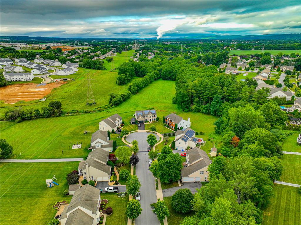 138 Clover Hollow Road Easton, PA 18045 - Photo 84 of 95 An aerial perspective reveals a cul-de-sac community nestled amongst verdant fields and mature trees.
