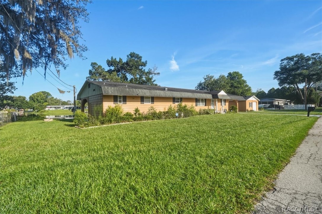 928 South Shad Terrace Inverness, FL 34450 - Photo 26 of 48 a view of a house with a yard