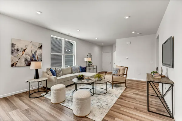 a living room with furniture and a window