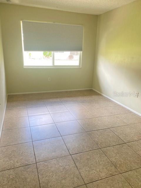 21150 Gertrude Avenue, Unit R1 Port Charlotte, FL 33952 - Photo 11 of 18 a view of a livingroom with a window