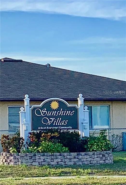 21150 Gertrude Avenue, Unit R1 Port Charlotte, FL 33952 - Photo 16 of 18 a sign on the side of a building