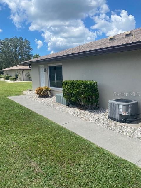 21150 Gertrude Avenue, Unit R1 Port Charlotte, FL 33952 - Photo 2 of 18 a backyard of a house with seating space