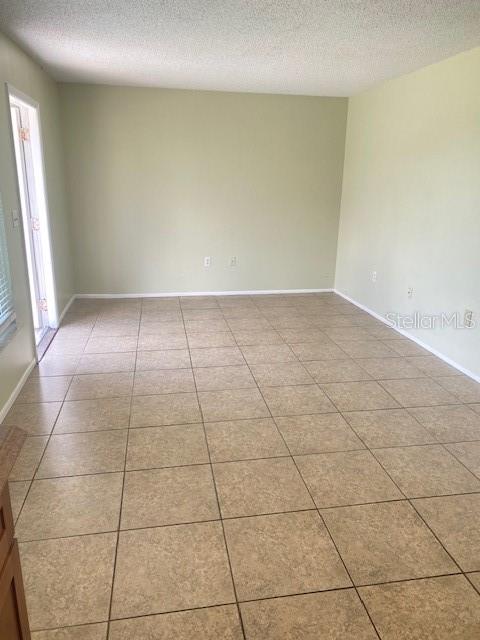 21150 Gertrude Avenue, Unit R1 Port Charlotte, FL 33952 - Photo 4 of 18 a view of a livingroom with an empty space and a window