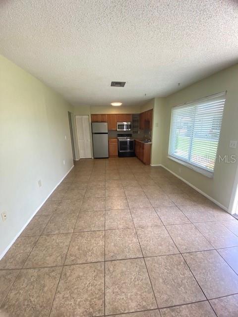 21150 Gertrude Avenue, Unit R1 Port Charlotte, FL 33952 - Photo 6 of 18 a view of an empty room with a window