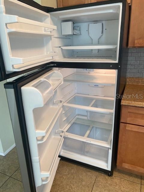 21150 Gertrude Avenue, Unit R1 Port Charlotte, FL 33952 - Photo 9 of 18 a view of walk in closet