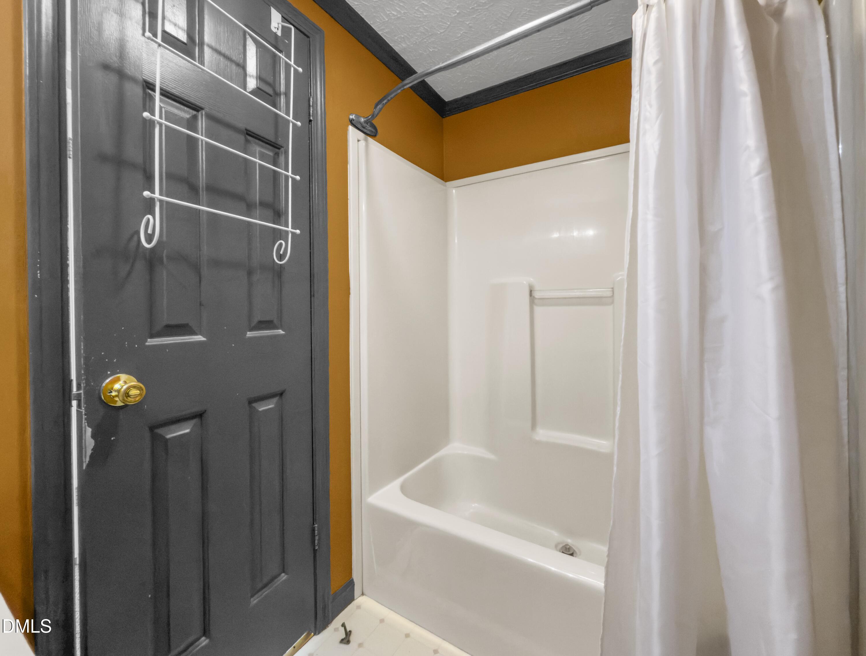 199 Iris Bryant Road Erwin, NC 28339 - Photo 17 of 33 a bathroom with a bathtub and shower