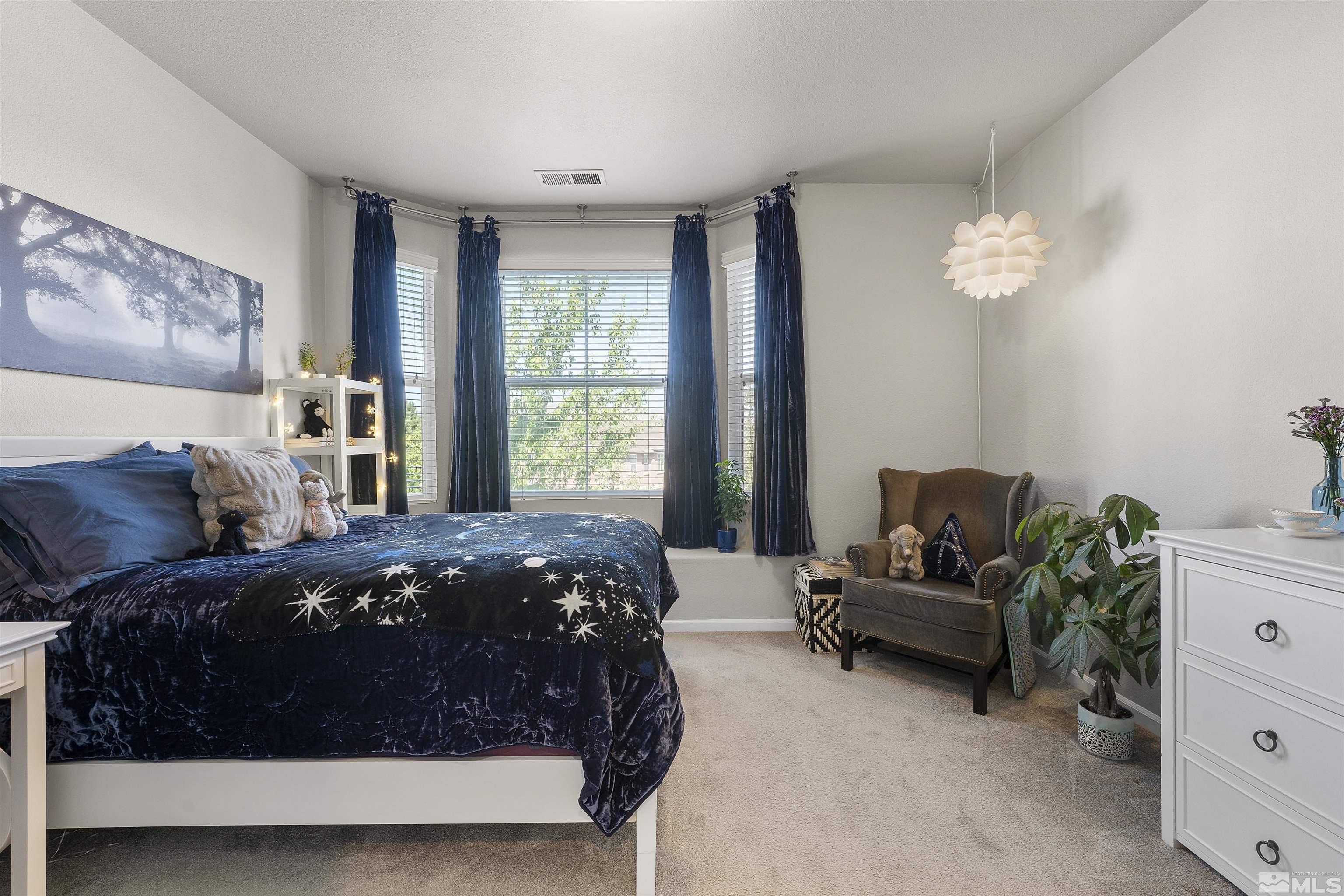 2212 Grosvenor Reno, NV 89509 - Photo 24 of 36 a bedroom with a bed and a window