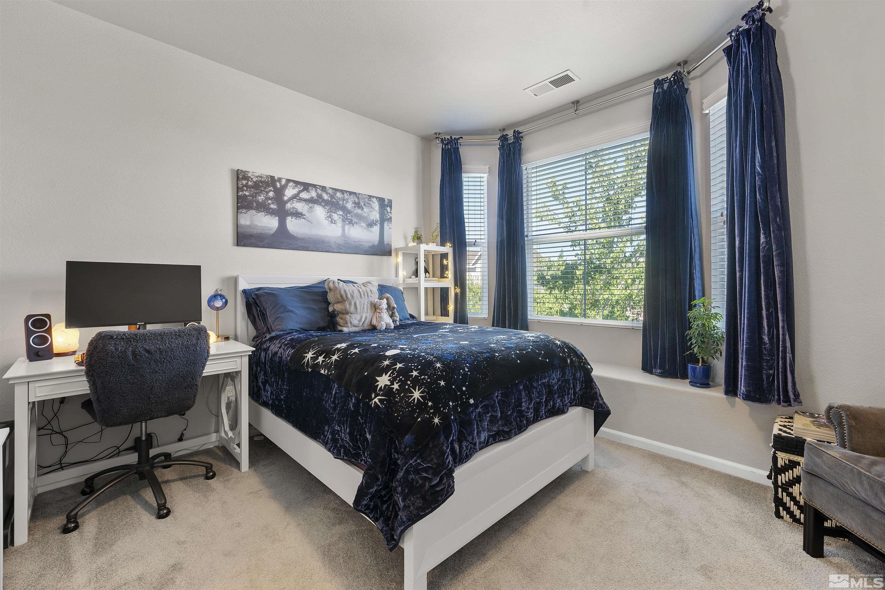 2212 Grosvenor Reno, NV 89509 - Photo 25 of 36 a bed sitting in a bedroom next to a window
