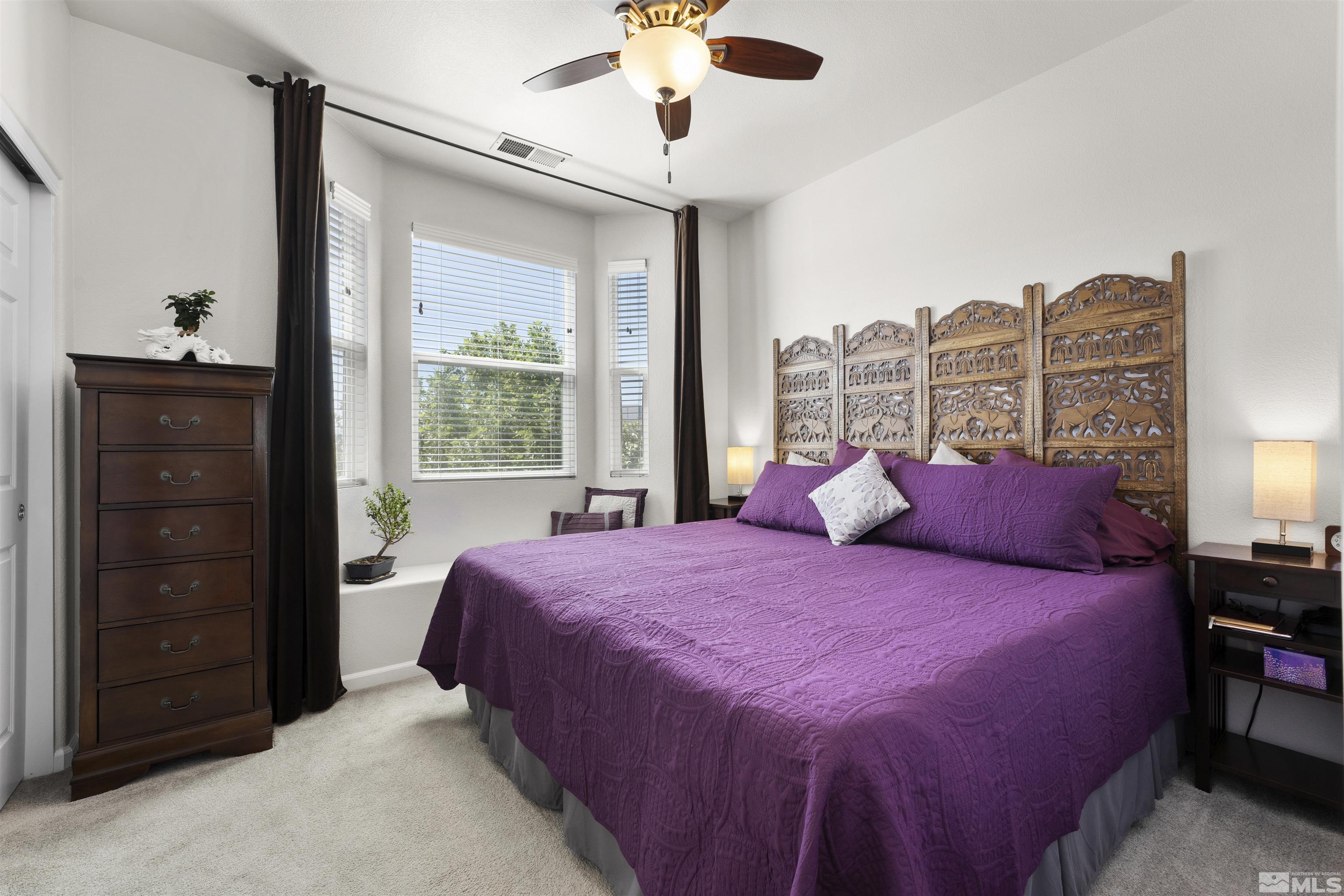 2212 Grosvenor Reno, NV 89509 - Photo 29 of 36 a bedroom with a bed and a chandelier