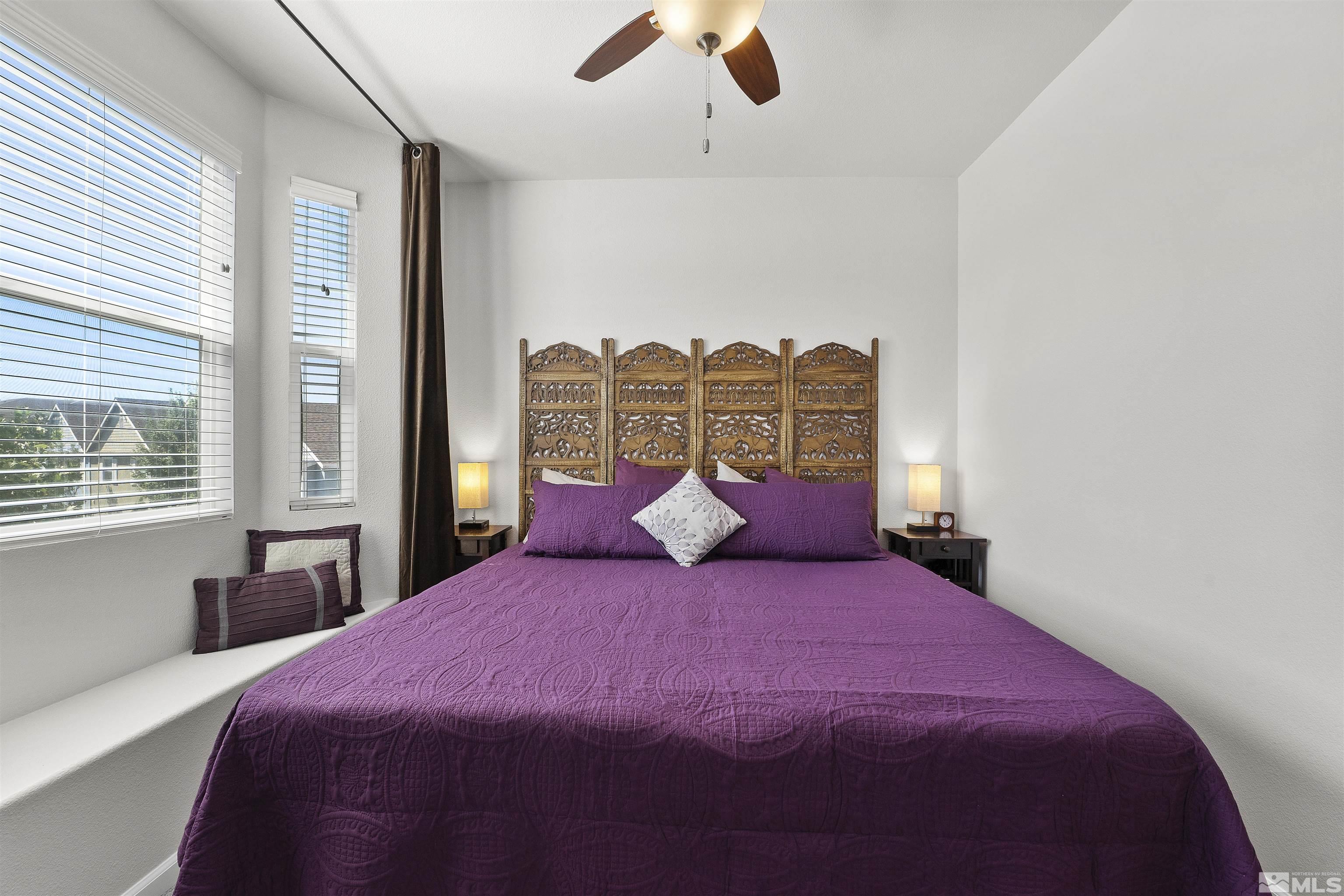 2212 Grosvenor Reno, NV 89509 - Photo 30 of 36 a large bedroom with a bed and a large window