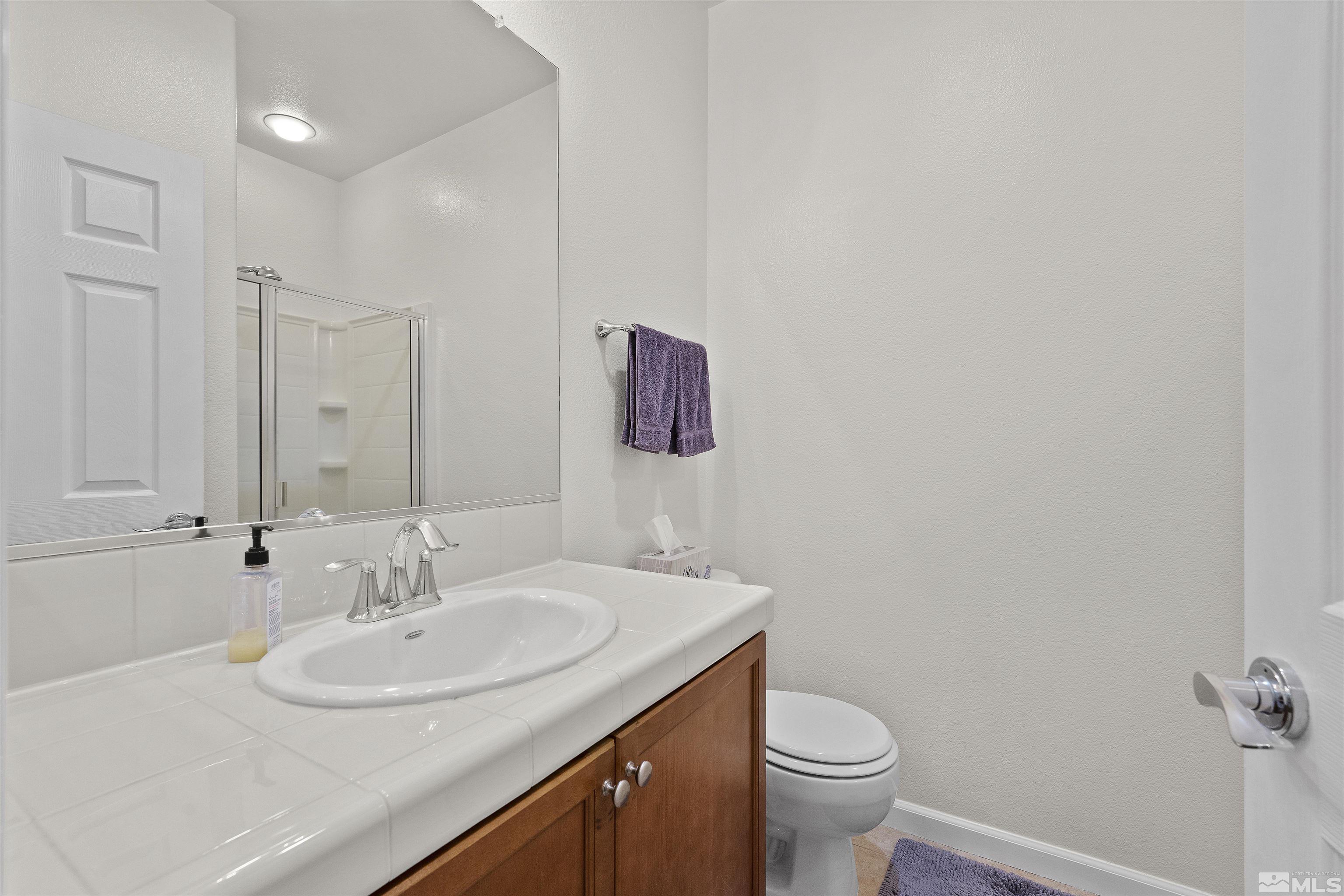 2212 Grosvenor Reno, NV 89509 - Photo 31 of 36 a bathroom with a sink and a toilet