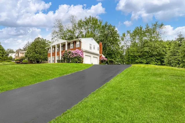 a front view of a house with a yard
