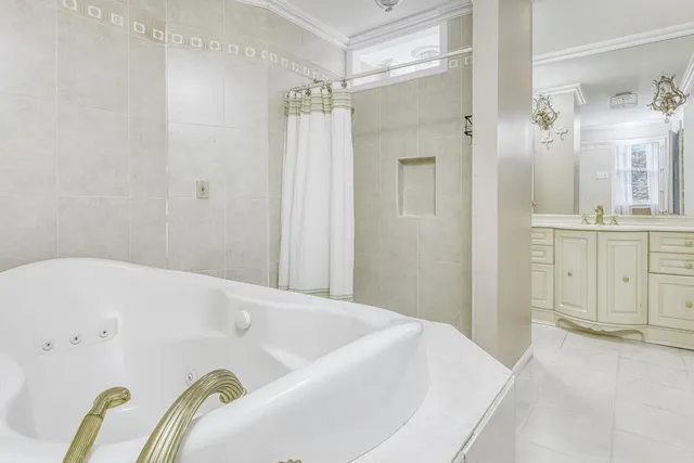 a bathroom with a tub and shower