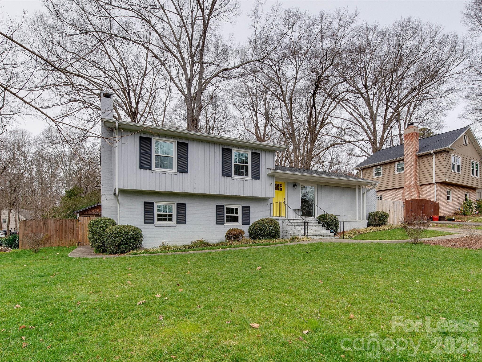 7026 Morganford Road Charlotte, NC 28211 - Photo 2 of 48 a front view of a house with a yard and trees
