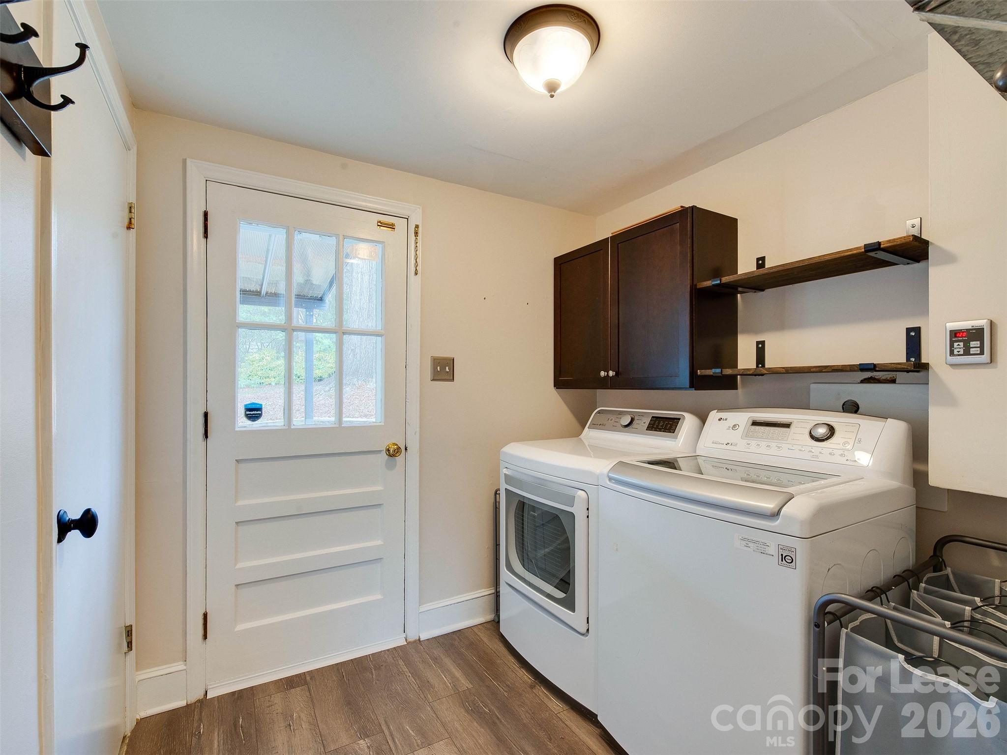 7026 Morganford Road Charlotte, NC 28211 - Photo 24 of 48 a view of washer and dryer with kitchen view