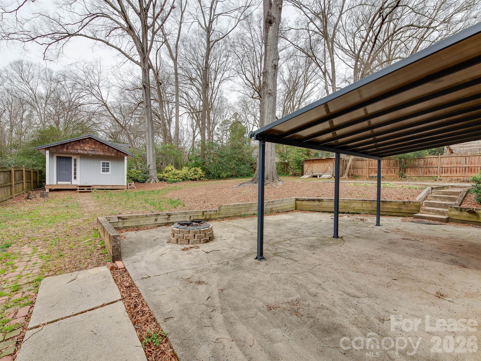 7026 Morganford Road Charlotte, NC 28211 - Photo 39 of 48 a view of a house with backyard and wooden fence