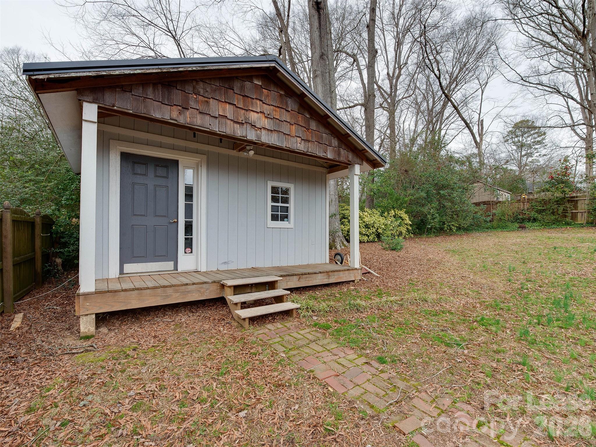 7026 Morganford Road Charlotte, NC 28211 - Photo 41 of 48 a view of backyard with a barn and wooden fence