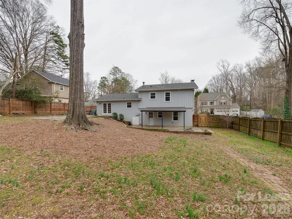 a house with trees in front of it