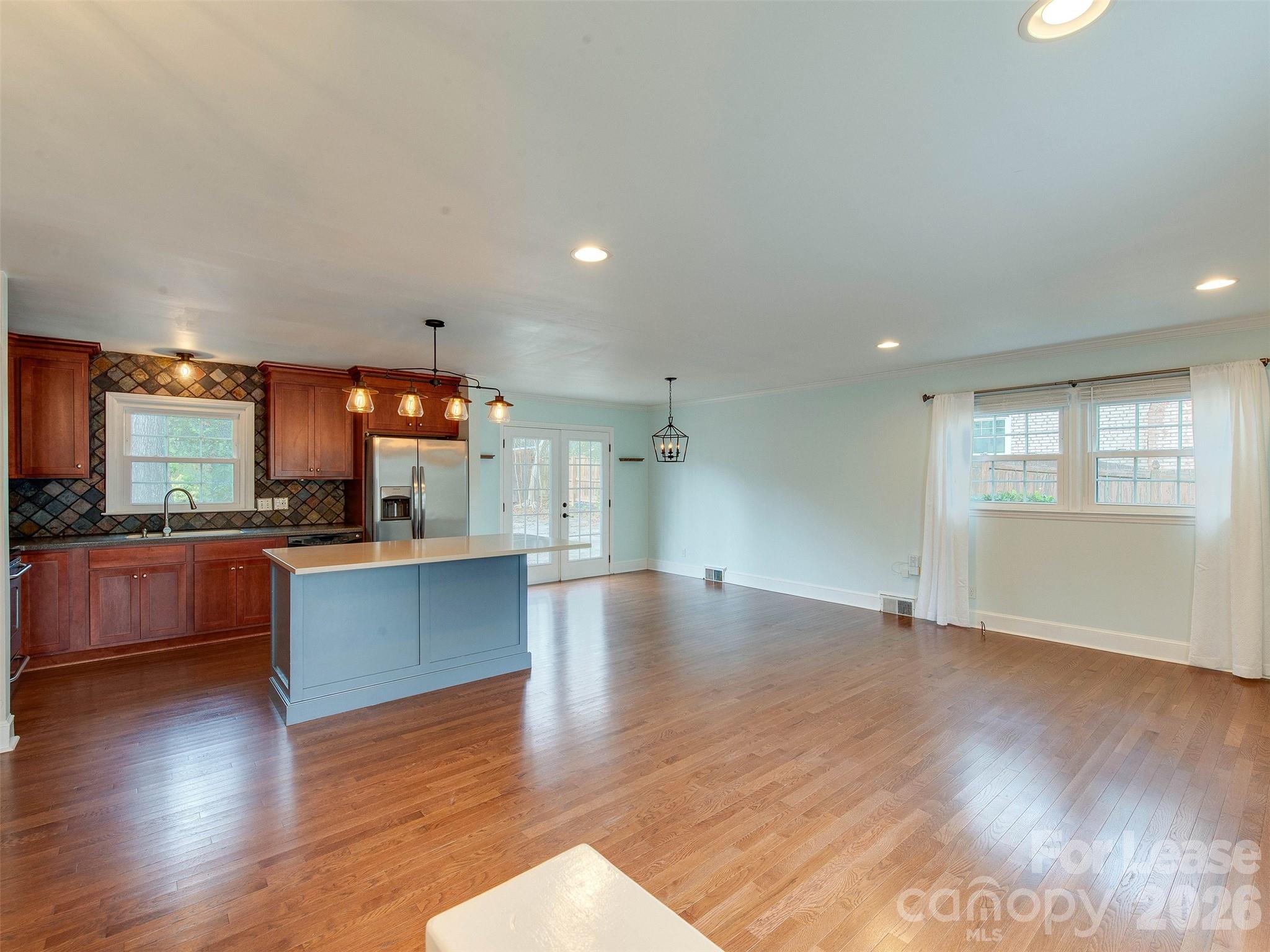 7026 Morganford Road Charlotte, NC 28211 - Photo 6 of 48 a view of large kitchen with wooden floor and large windows