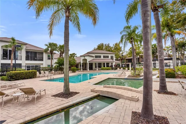 a house with palm tree in front of it