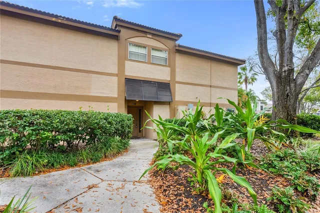 a couple of potted plants in front of door