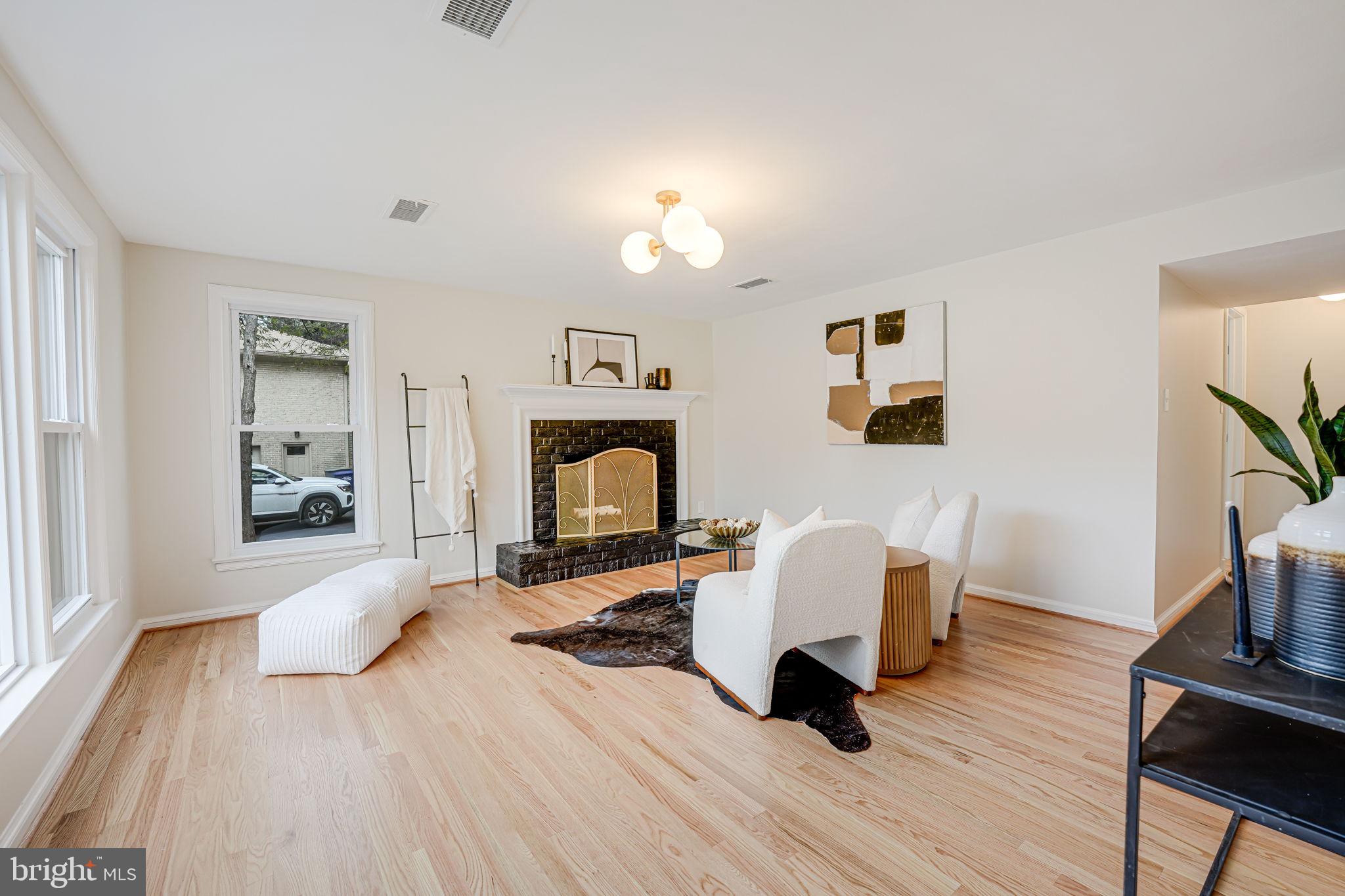 7401 Fort Hunt Road Alexandria, VA 22307 - Photo 41 of 56 a living room with furniture and a fireplace