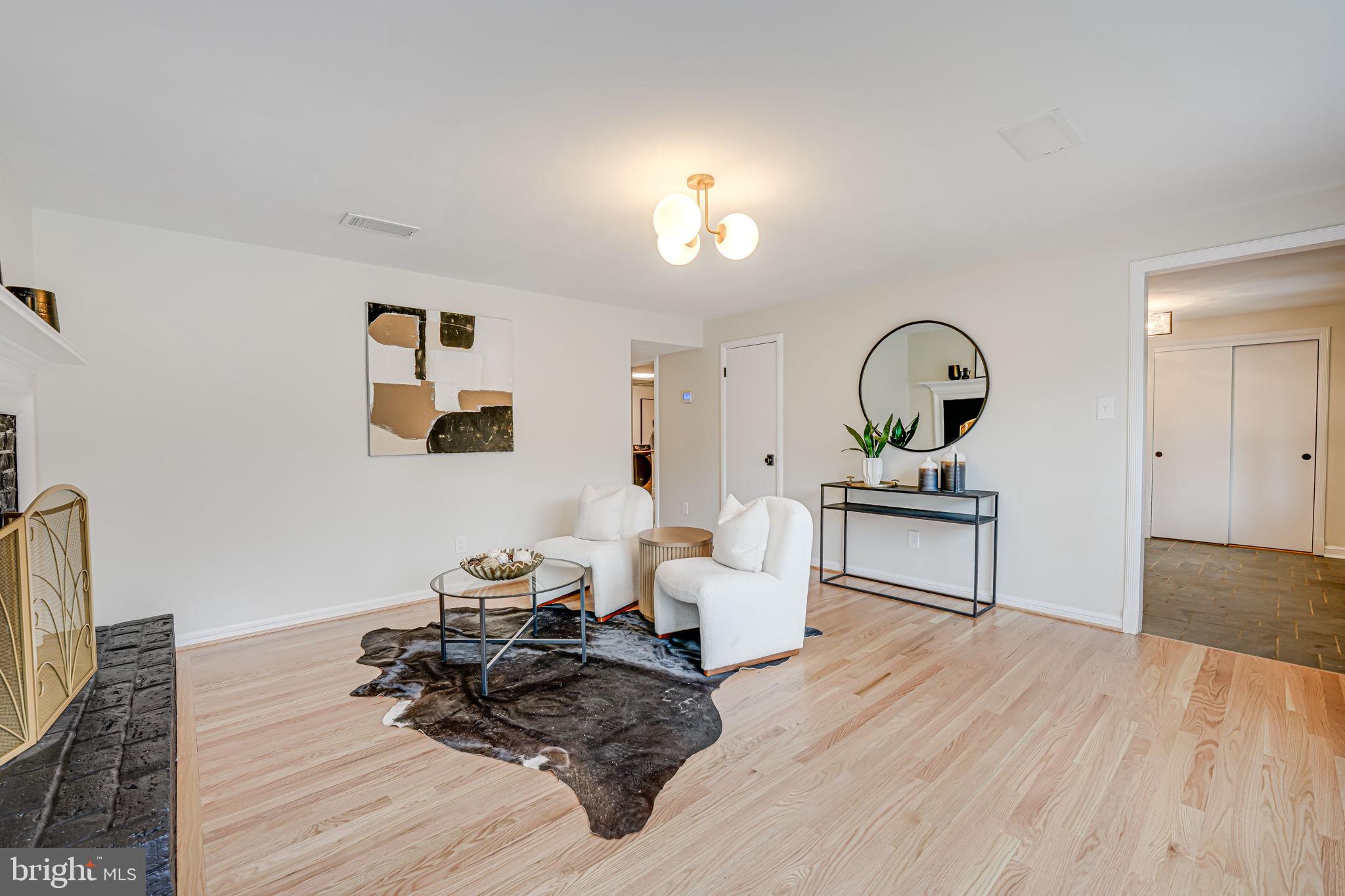 7401 Fort Hunt Road Alexandria, VA 22307 - Photo 42 of 56 a living room with furniture and a wooden floor