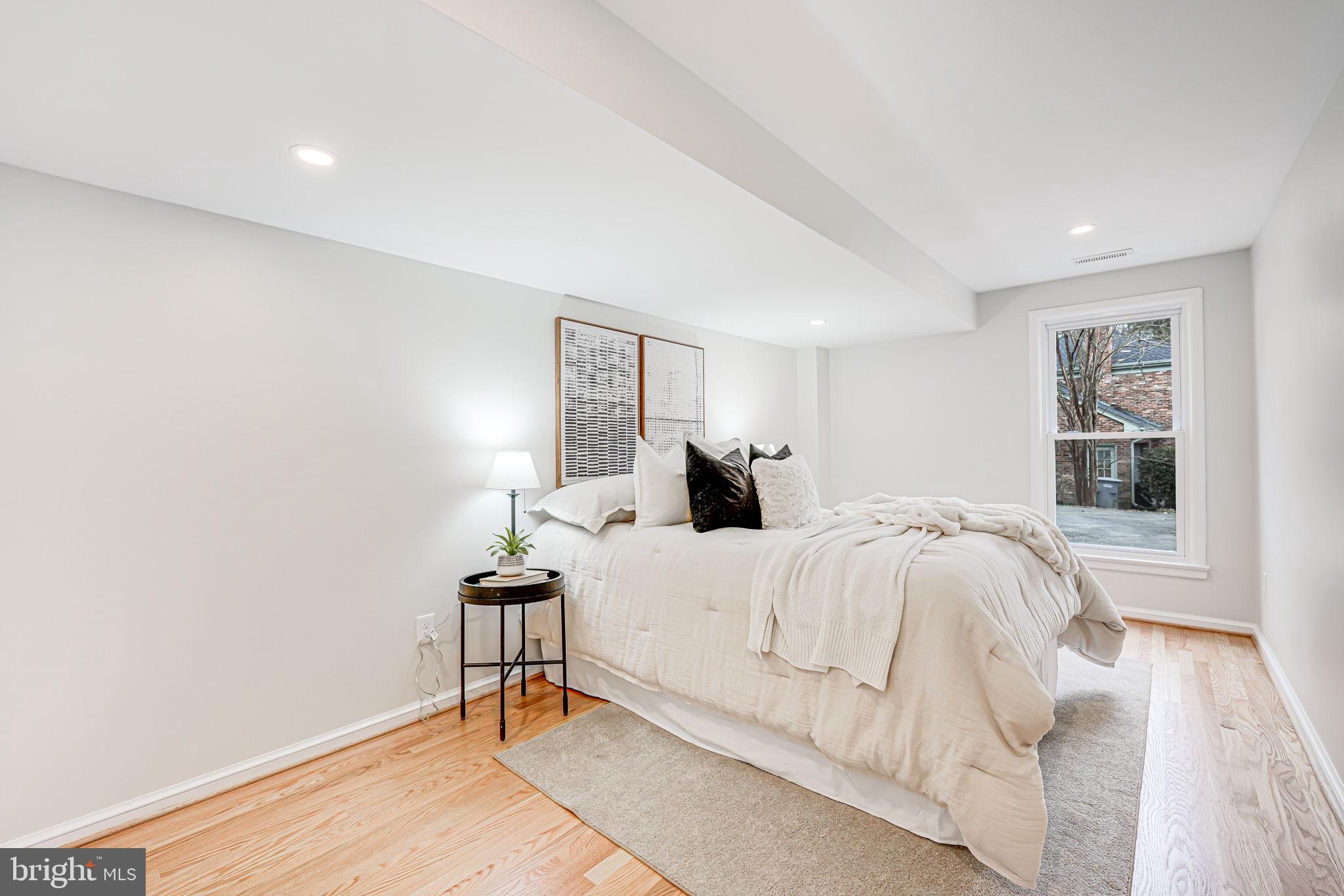7401 Fort Hunt Road Alexandria, VA 22307 - Photo 46 of 56 a bedroom with a bed and a window